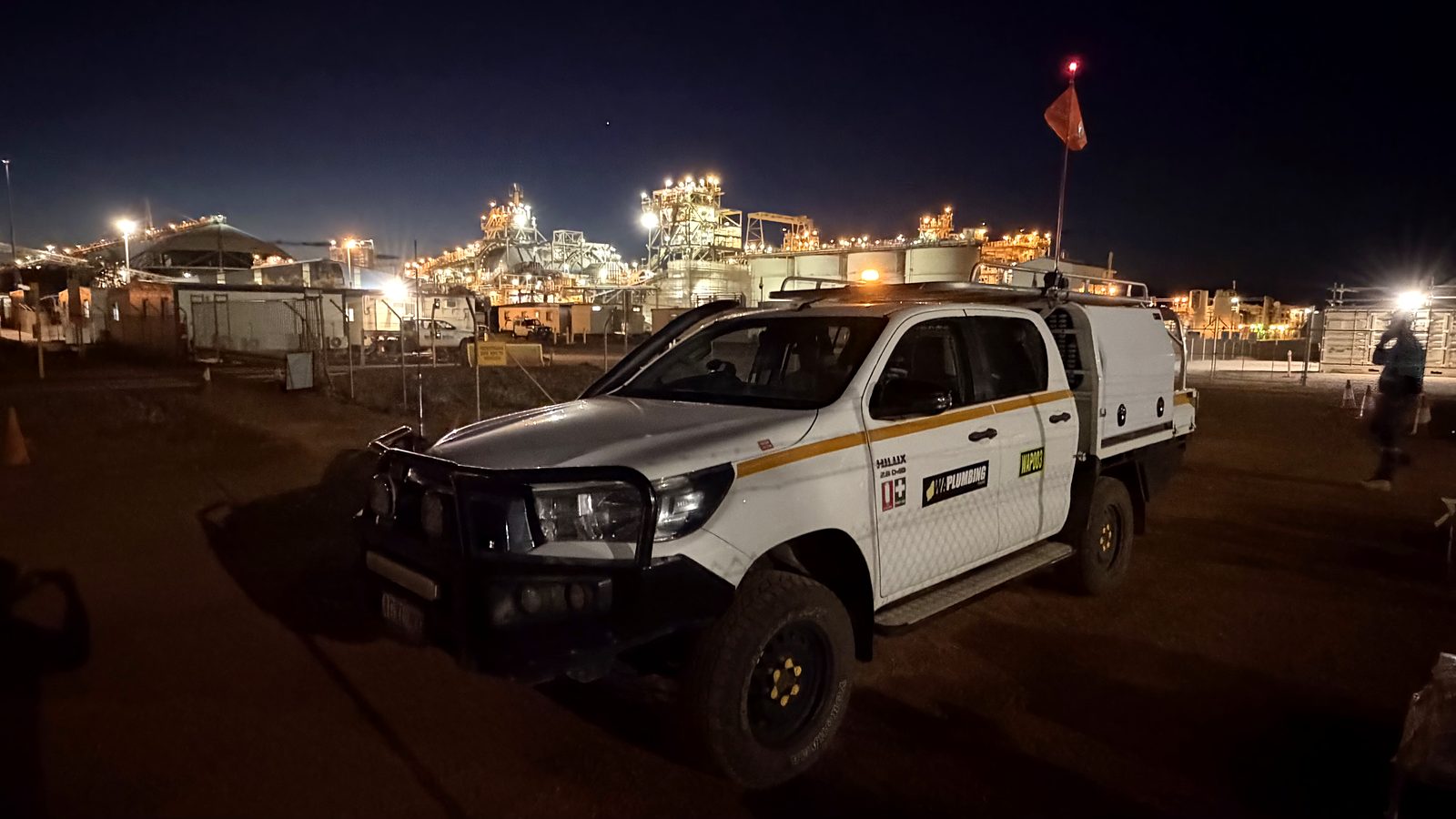 WA Plumbing service vehicle at a Pilbara mine site at night
